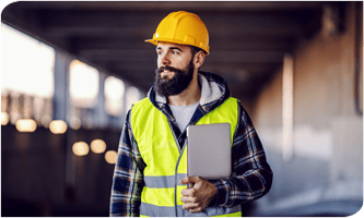 Construction worker holding clipboard