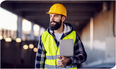 Construction worker holding clipboard